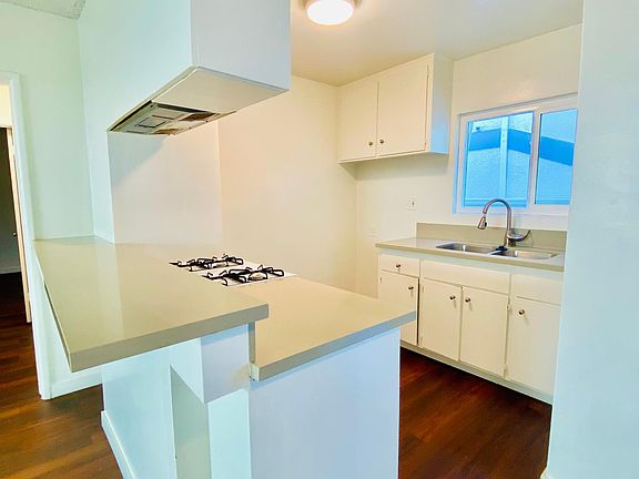 Open kitchen with breakfast bar.