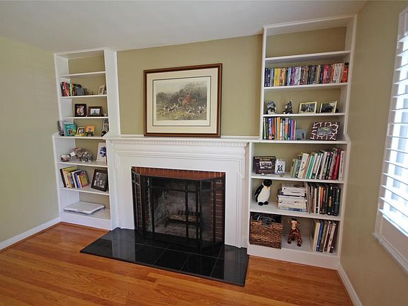 Wood burning fireplace and built in bookshelves.