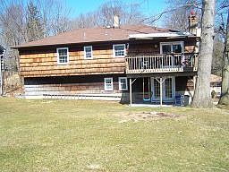 BACK OF HOUSE/LARGE LEVEL BACK YARD