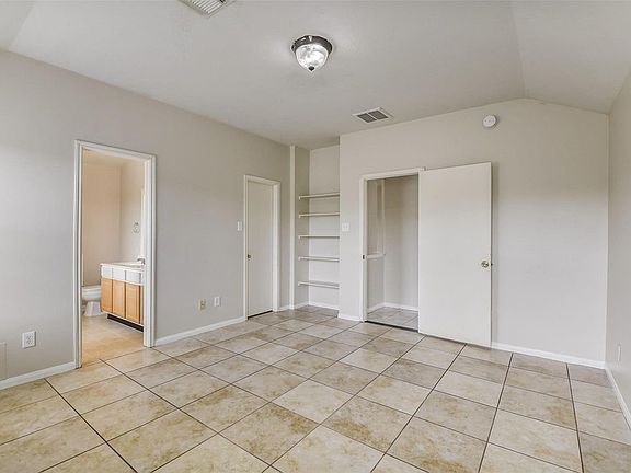 Master bedroom with walk-in closet and en-suite bathroom