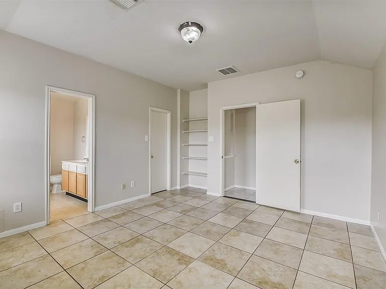 Master bedroom with walk-in closet and en-suite bathroom