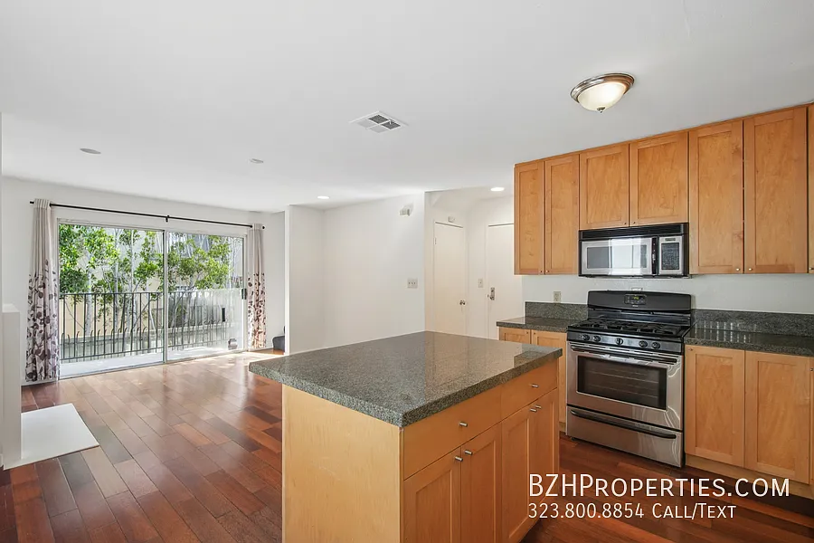 Bright Two-Story Townhome with Fireplace, Balcony & 2-Car Garage Parking — Photo 4