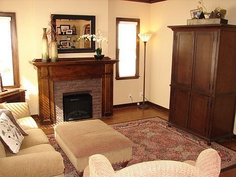 Living Room w/ Brick Fireplace