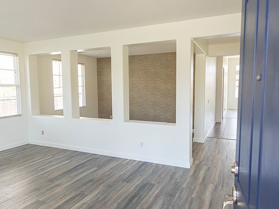 Front door entrance into the formal living/dining and 4th bedroom/office space