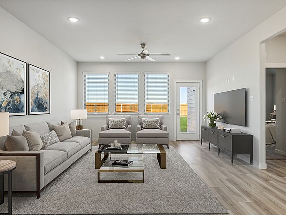 Living Room in the Willow home plan by Trophy Signature Homes - REPRESENTATIVE PHOTO