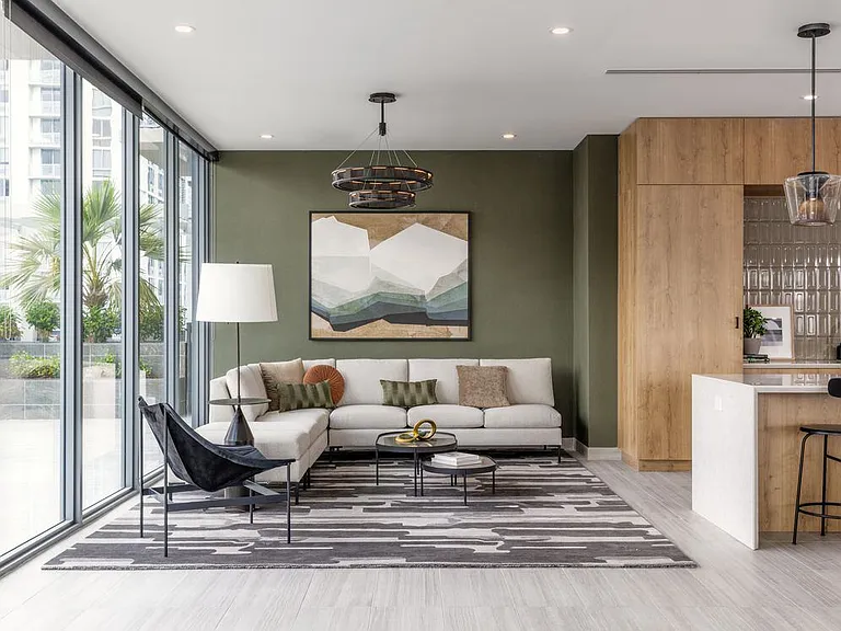 Resident lounge with modern seating and kitchenette