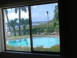 VIEW OF POOL FROM DINING RM