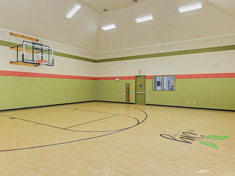 Game on! Our full-size indoor basketball court is a favorite perk for residents looking to shoot hoops or stay active year-round.