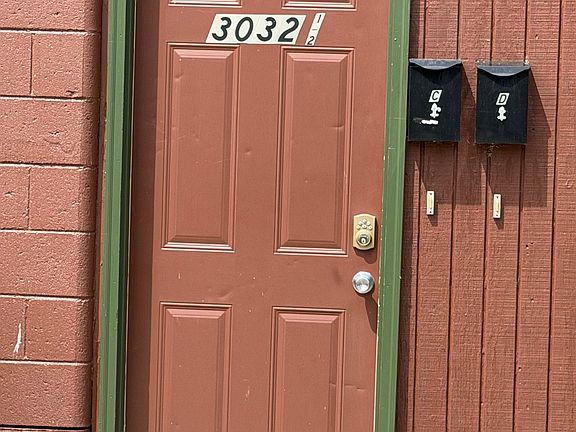 Entry door on the side of the building for Apt. C