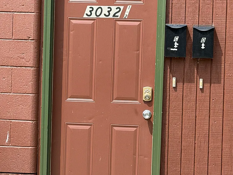 Entry door on the side of the building for Apt. C