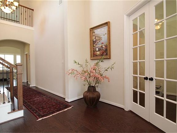 Inside foyer, study with French doors to the right.