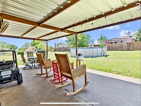 Back covered porch and patio (pool has been removed)