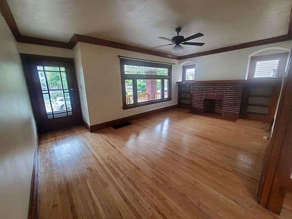 Living room overlooking large front porch for 1st floor unit