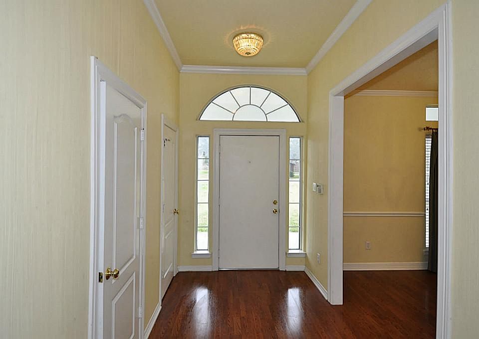 This is a shot of the foyer. The formal dining is up front and this long hall leads to the family room.