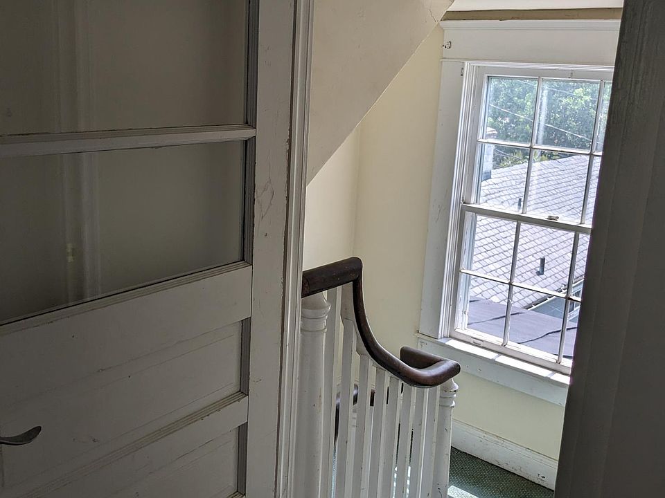 Front door, facing the stairs