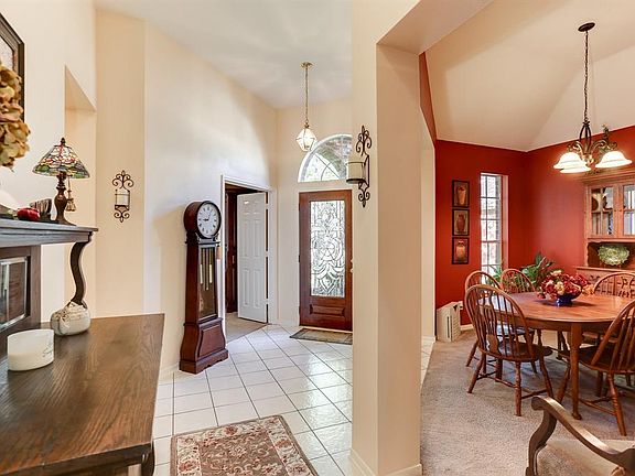 Foyer view from kitchen showing dining room.