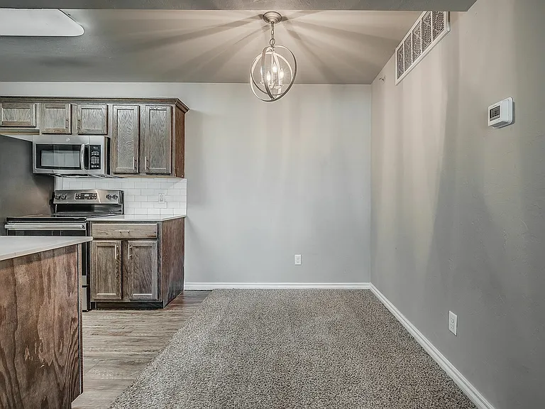 Experience contemporary living with this well-appointed kitchen and dining area.