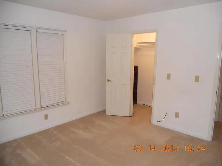 guest bedroom with private bathroom and closet