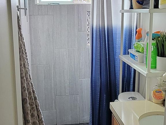 Bathroom window looks out to your own private yard