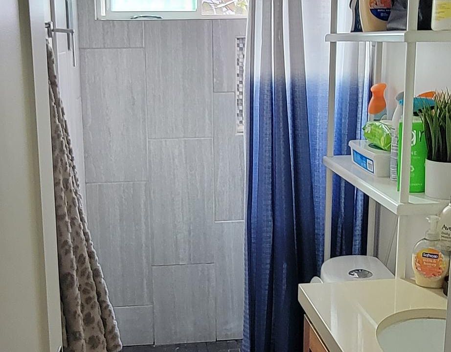 Bathroom window looks out to your own private yard