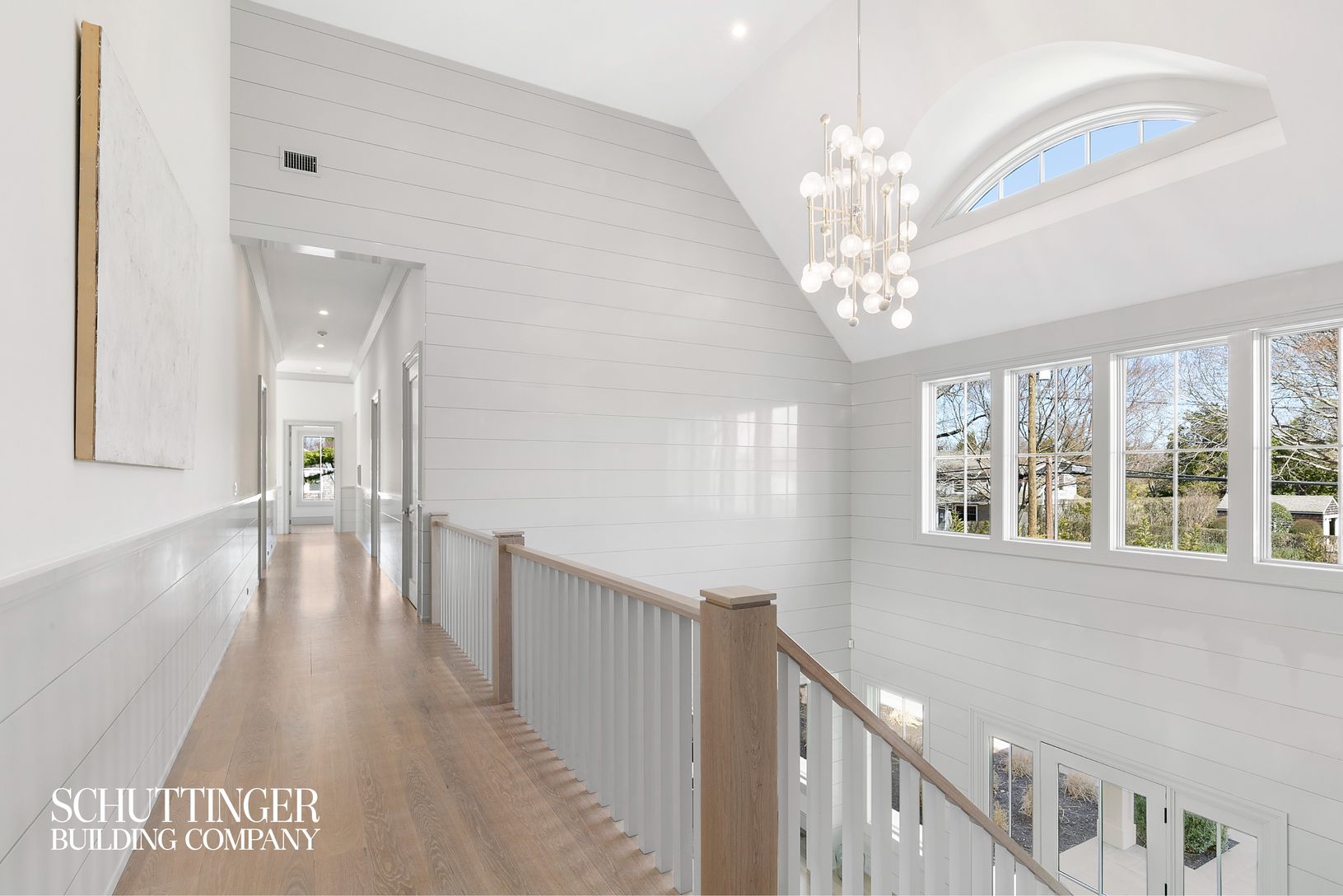  2nd Floor Landry with High Gloss Shiplap Paneling and Beautiful Chandelier 