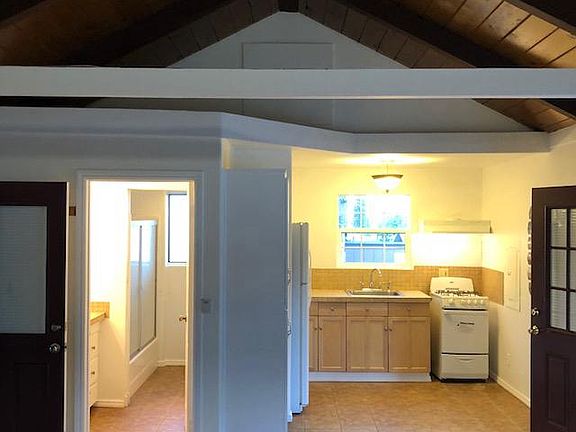 Kitchen with new gas stove and oven refrigerator included