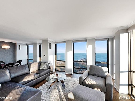 Spacious living area with views of the lake and city