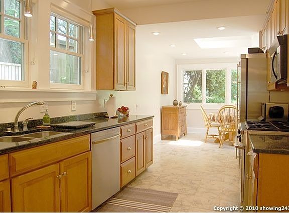 Beautiful kitchen with custom maple cabinets, granite counters and stainless appliances.