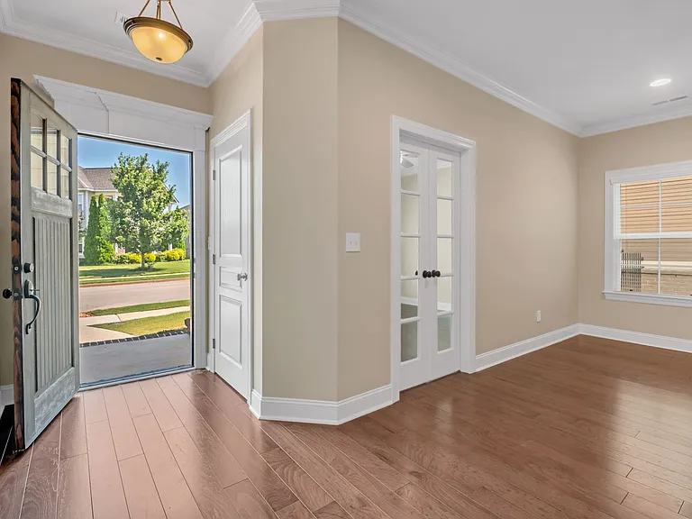 The foyer includes a coat closet and the office includes French doors