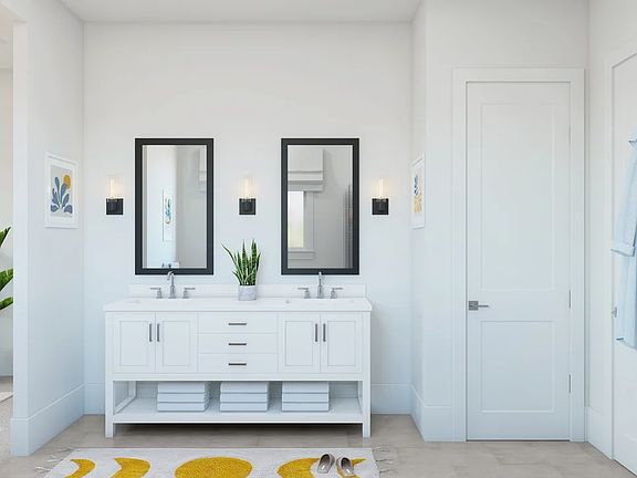 Primary bath featuring freestanding vanity with dual sinks