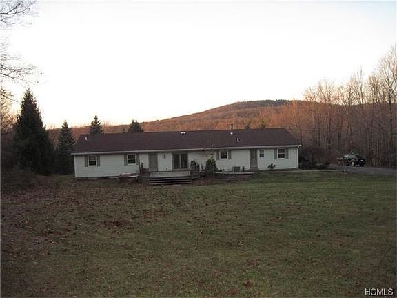 Rear view showing big yard and mountain views.