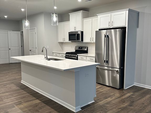 Open concept kitchen with generous island.