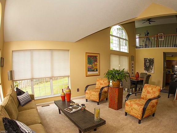 Open concept great room, dining area and view to kitchen & loft above!