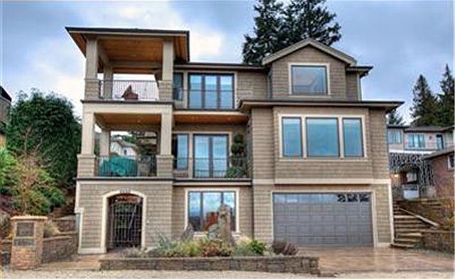 Enjoy lake, city and mountain views from this 3-level custom home.