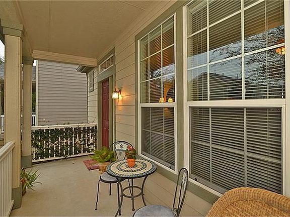 The covered front porch is a warm welcome to guests and the perfect place to relax with friends or family.