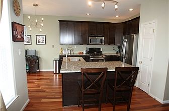 Kitchen features new cabinets & granite counters