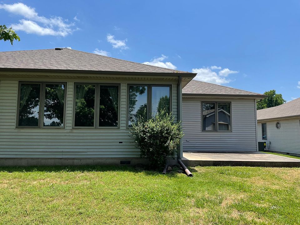 Back yard patio with detached golf shed