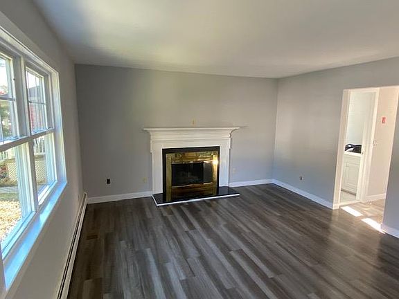 Wood burning fireplace in a large living room