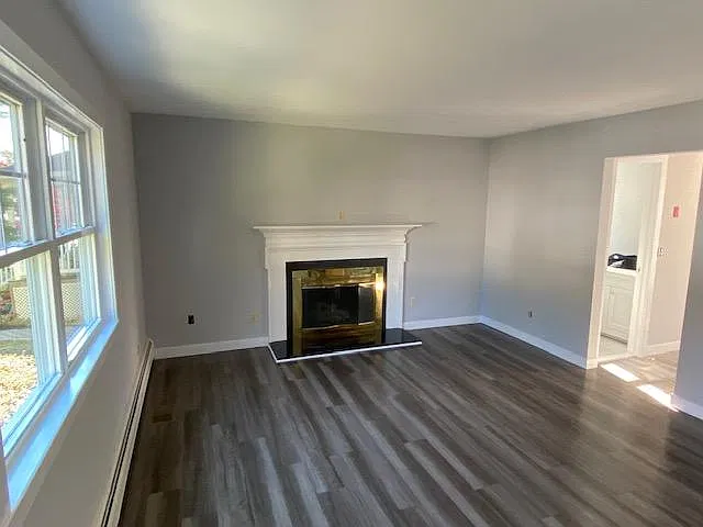 Wood burning fireplace in a large living room