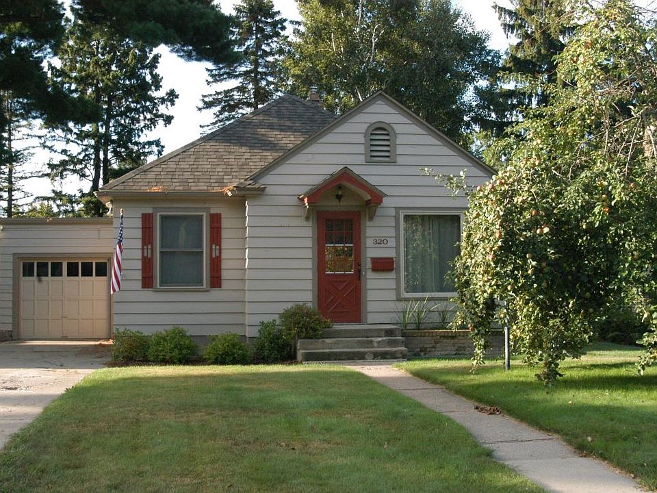 Adorable house with apple tree in the front yard