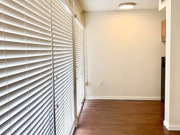 Floor to ceiling windows across front of unit