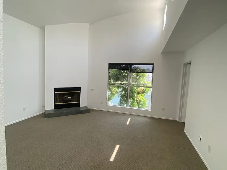 Spacious master bedroom w 3rd fireplace and high ceilings