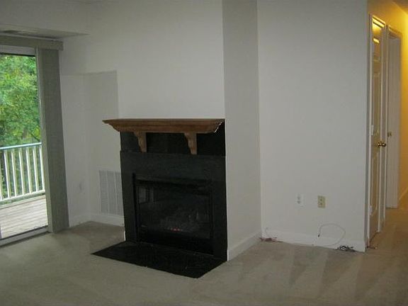 Gas fireplace, sliding glass door to private balcony with wo