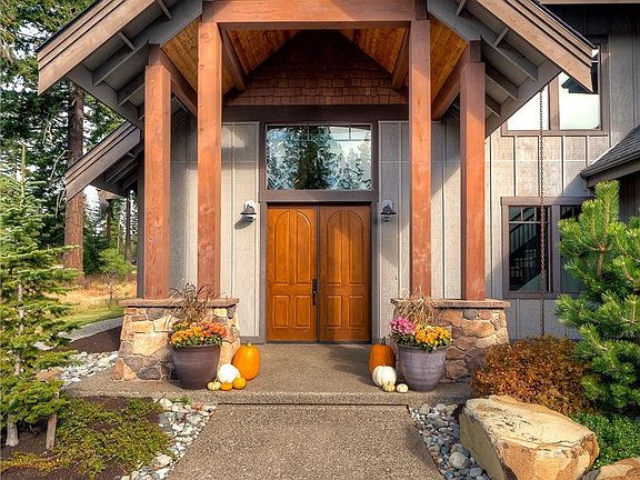 Grand entrance with large window above the southern facing front door which allows abundant natural light to flood the interior of the home.