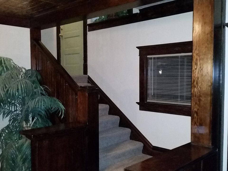 Stairs going to second floor where apartment is located