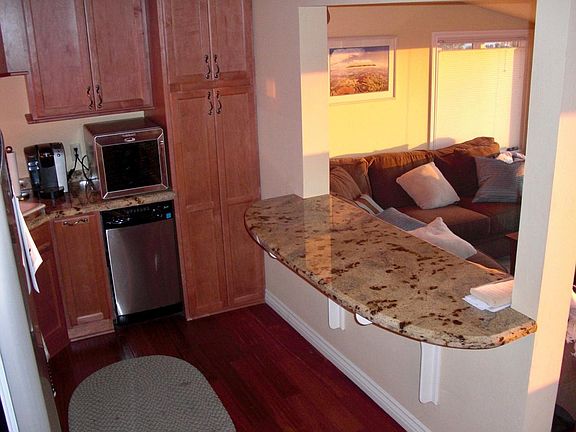 Upgraded Kitchen with Granite Counters, hardwood floors