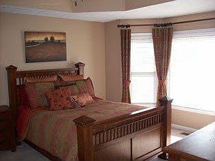 Master bedroom features trey ceilings & bay window