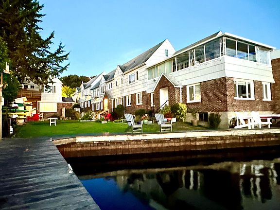Lots of outside space including grass courtyard, dock and gardens