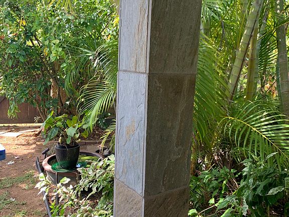 Covered entrance with Lush Tropical Decor