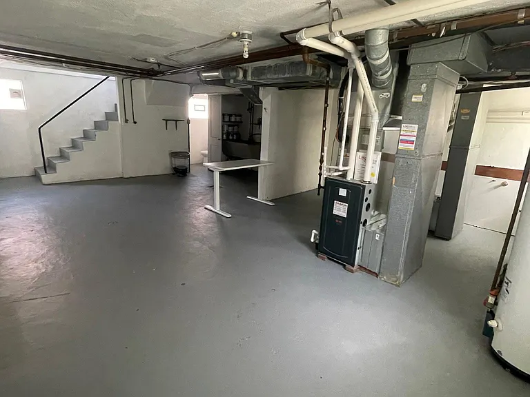 Clean large basement area with dedicated washer/dryer hook up and private storage